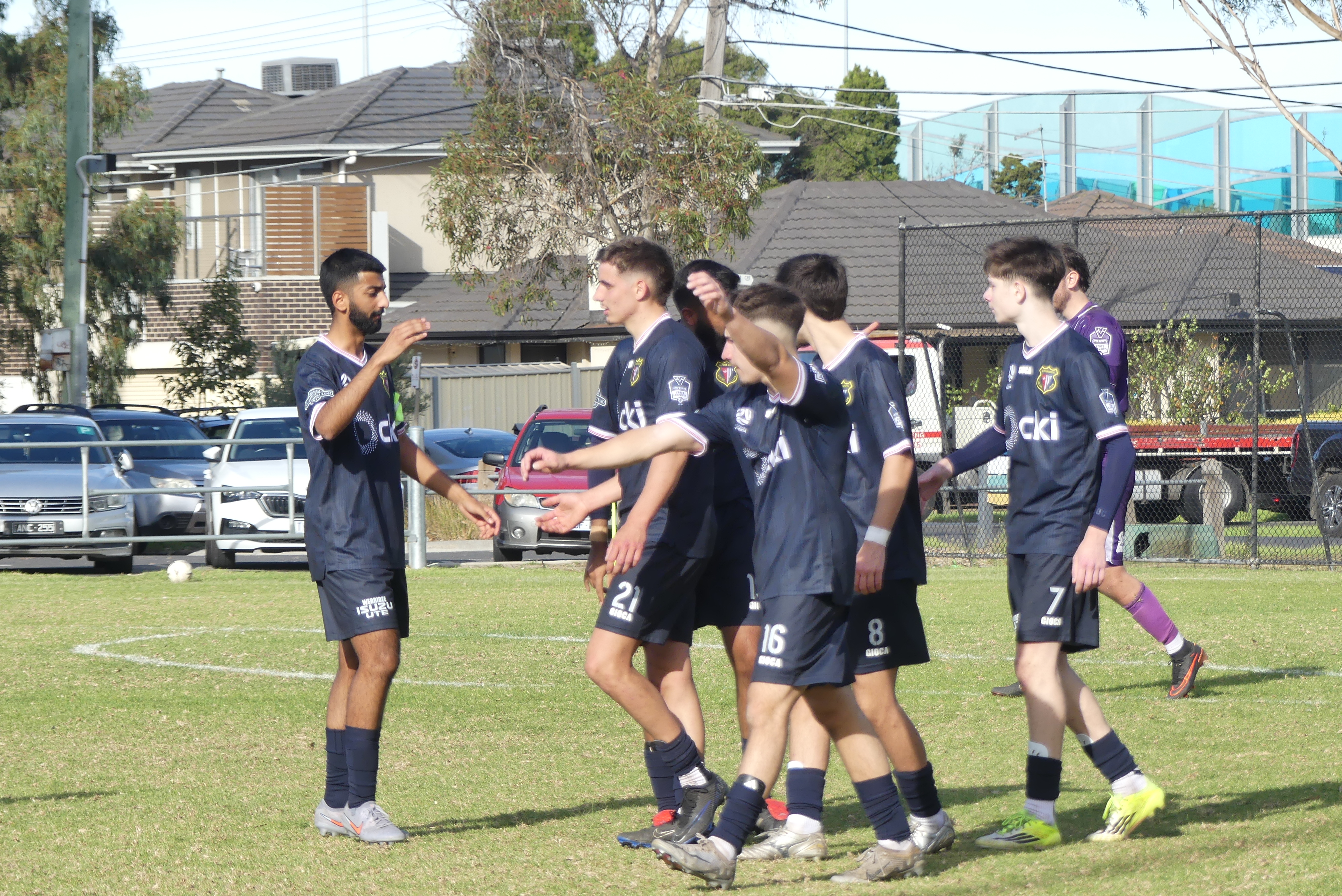 Altona North Reserves players celebrating a goal at Duane Reserve